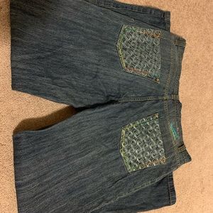 A pair of Massive Revolution mens Jean wear. Multi colored